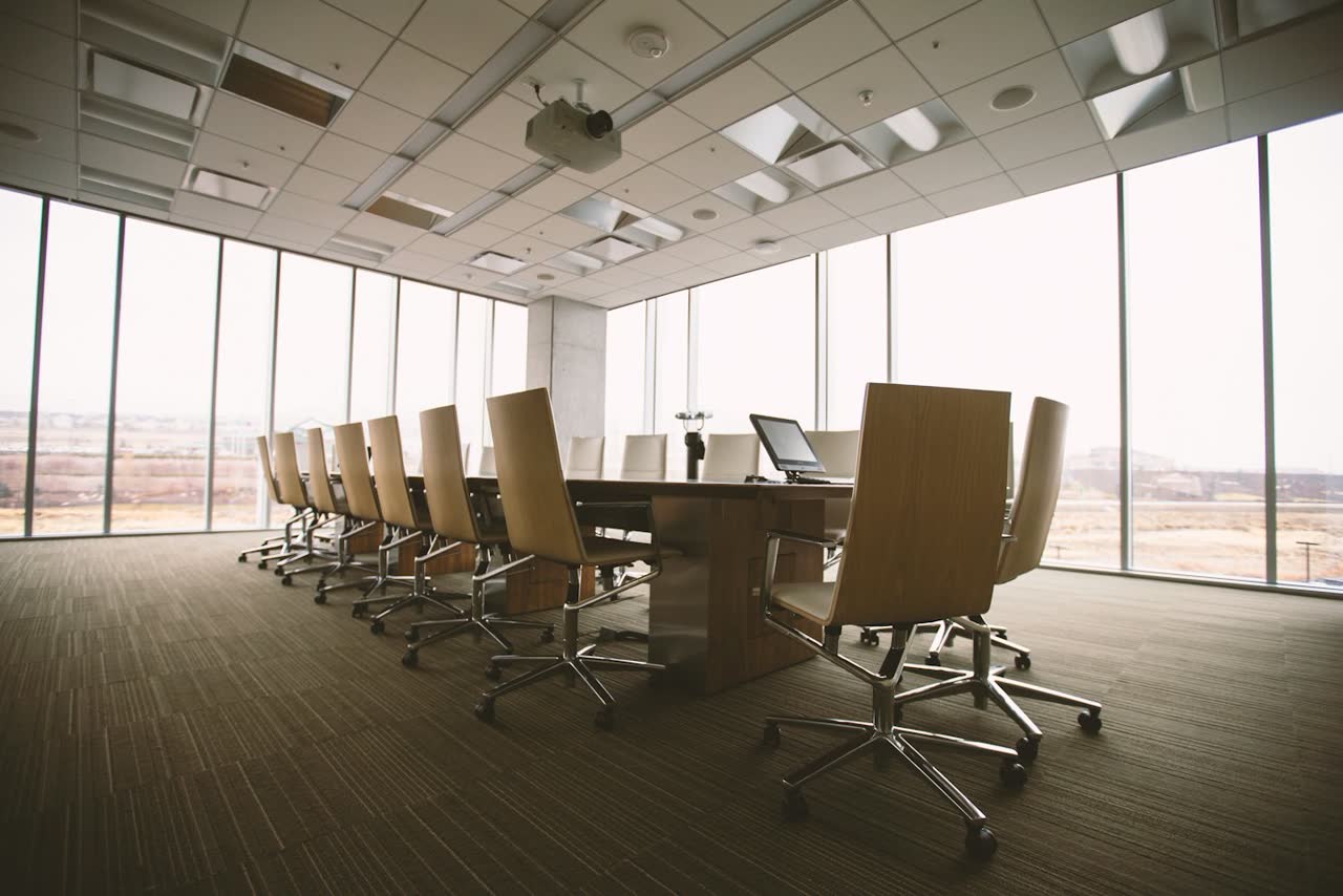 Meeting room phones and screens used for business messaging workflows